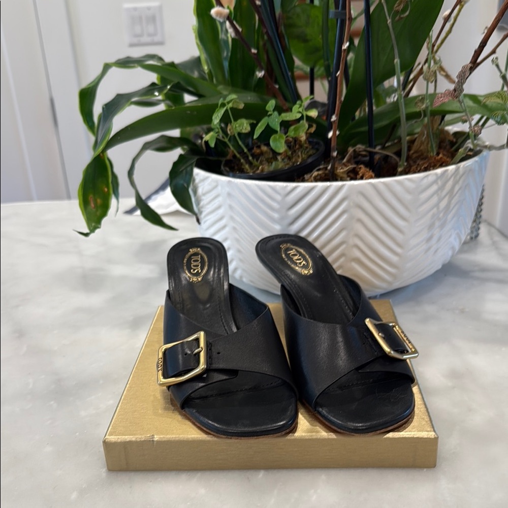 Tod's Black Leather Mules with Gold Buckle